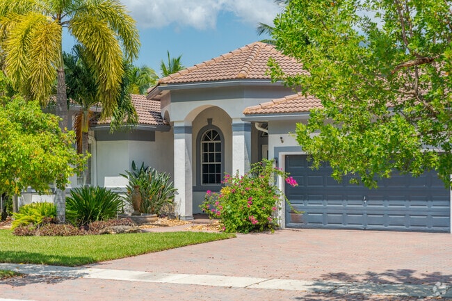 Enjoy lush landscaping with manicured lawns in Harbour Lakes Estates.