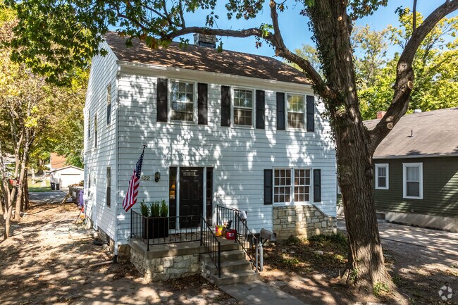 A few Colonial Revival homes sit in East Campus, shaded by large oak trees.