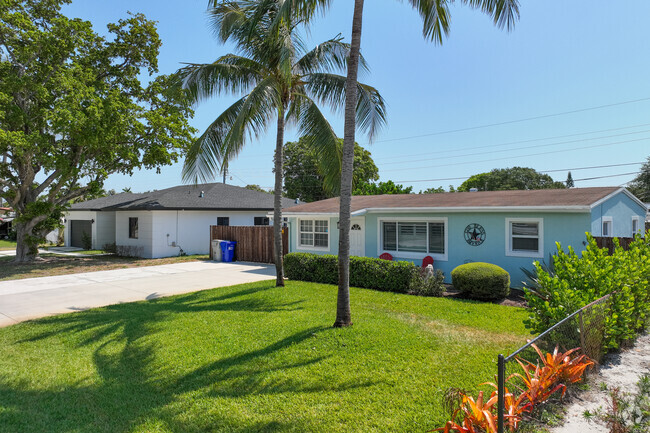 Residential homes have large front yards in the Cresthaven neighborhood of Pompano Beach, FL.