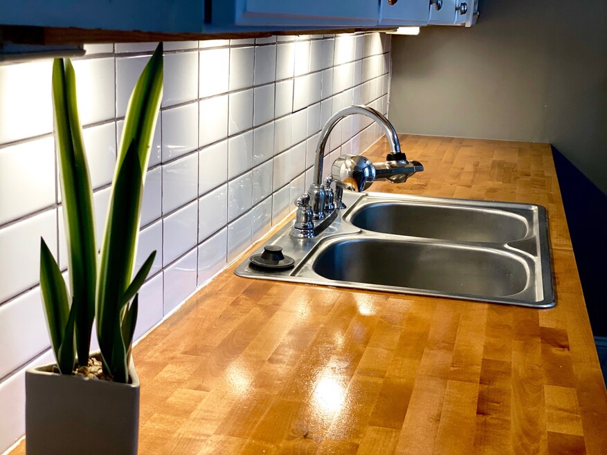 Brand new backsplash and butcher block countertops.