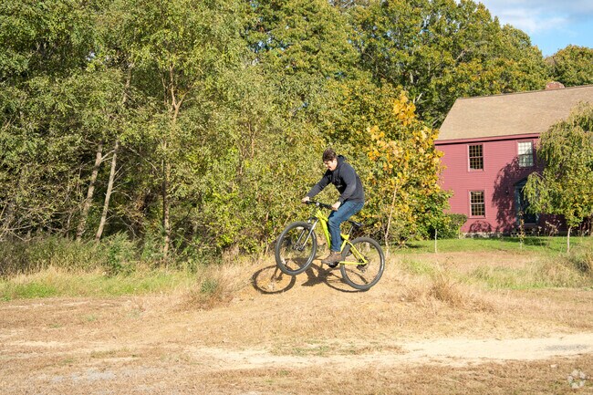 A cyclist has fun on the trails near Turbesi Park in Blackstone