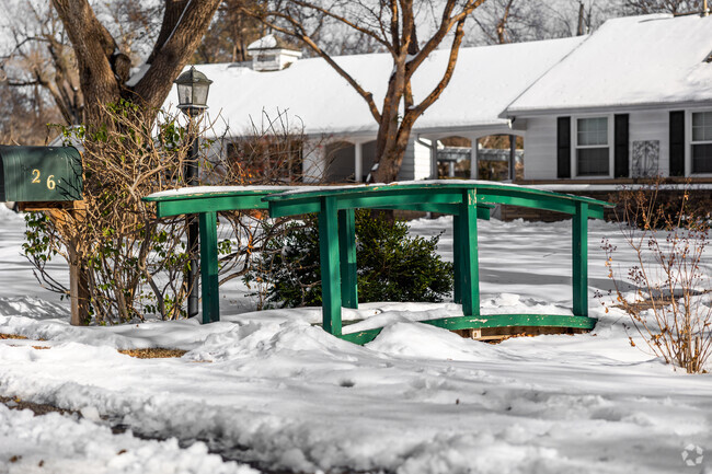 This Forest Hills home has a fun little bridge leading to the entry of the home.