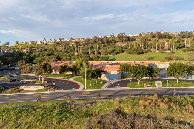 Surrounded by tall mature trees and beautiful landscape is Clarence Lobo Elementary School.