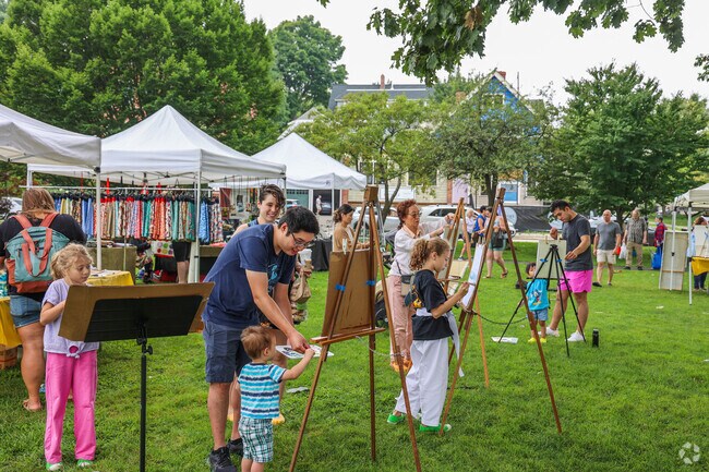Folks enjoy painting a masterpiece at Art in the Park.
