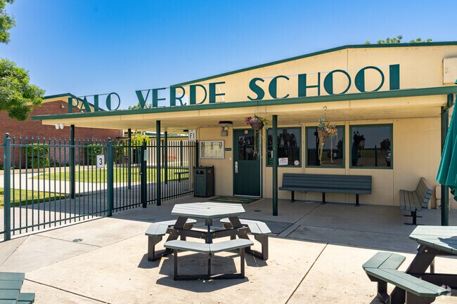 Families use the picnic tables at Palo Verde Elementary School for meals and gatherings.