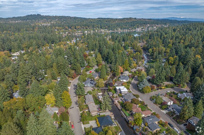 Homes along the Lake Oswego Canal in Blue Heron showcase waterfront living with private docks, lush landscaping, and access to Oswego Lake for an upscale lifestyle.