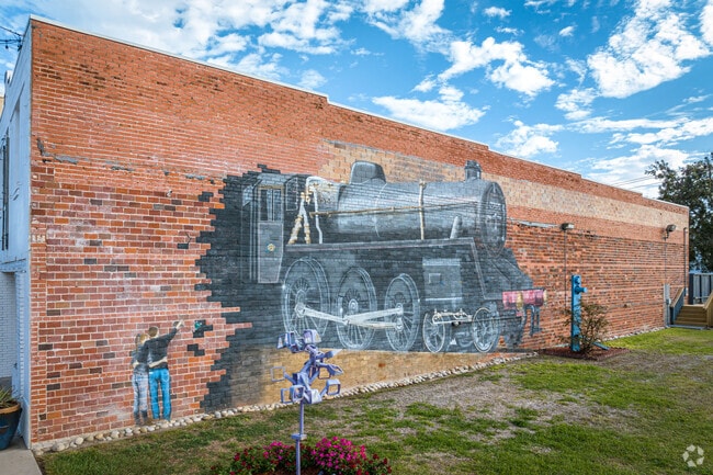 The train mural in Rosenberg was created by artist Paul Smith in 2011.