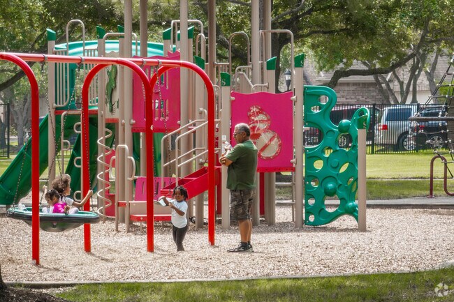 Children enjoy the expansive playground at Southern Trails Park.