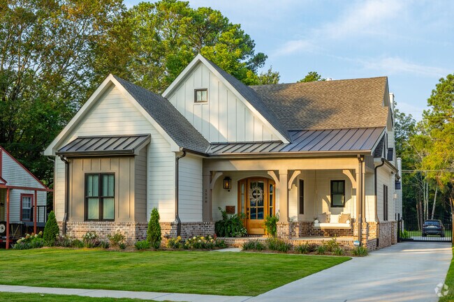 Beautiful Craftsman-style homes glow with sunrise light in Mayfair-Piedmont.