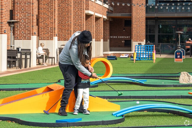 Putt on the putting green in front of Hey Day Market in Northwest Auburn.