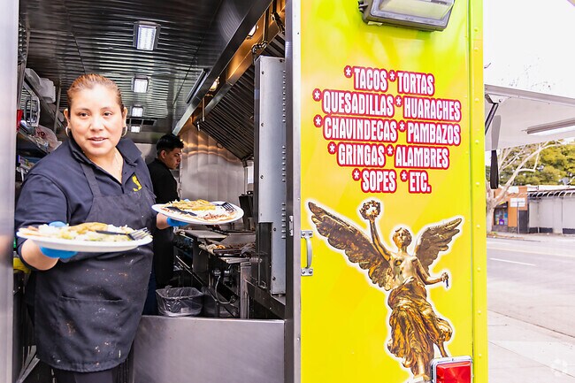Locals can get dinner from food trucks that fill the corridor in the evening.