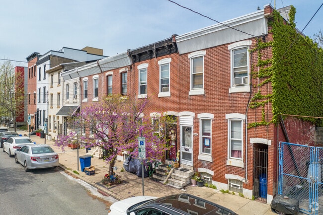Traditional Philadelphia brick row homes dominate Fishtown's residential streets.