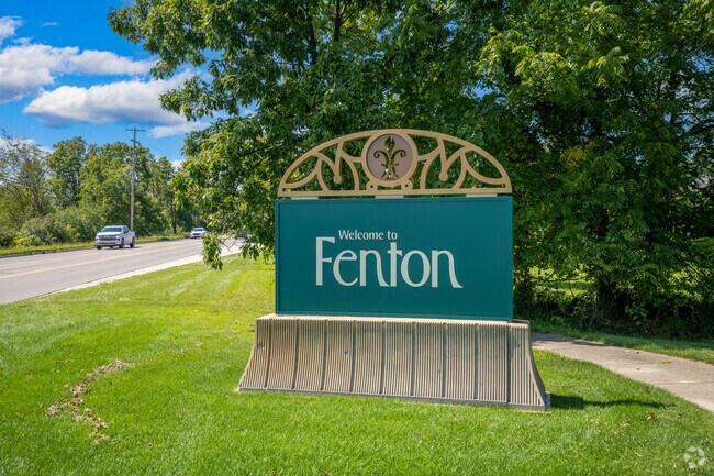 A welcoming sign greets visitors along Main Street in Fenton Township.
