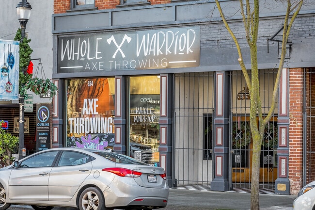 Whole Warrior Axe Throwing features projected gaming systems for family fun in Woodland.