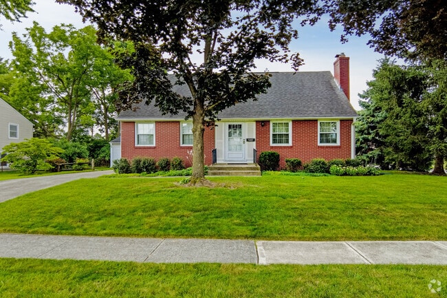 Colonial Revival homes in Lincoln Village showcase classic architecture and green yards.