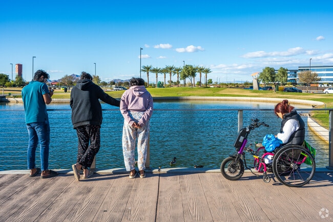 A family enjoys feeding the ducks found at Riverview Park.