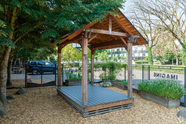 A gazebo is shaded by the trees at Bridges Middle School on SW 1st Ave in Portland.