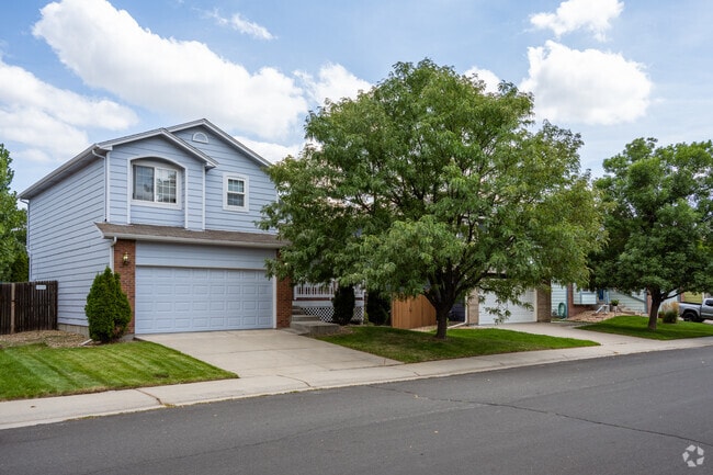 Mature trees provide shade to craftsman-style homes in Willow Run.