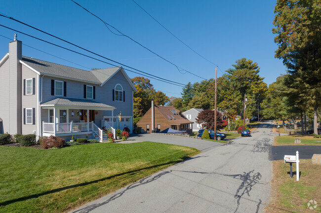 Large two story homes with lots of front porch sitting to enjoy the can be found in Assonet Bay.