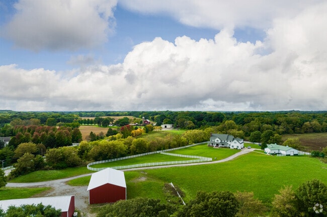 A farm at the edge of Ivanhoe, IL, being shined on by the sun.