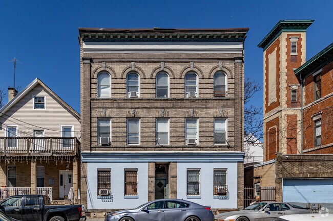 This historic brick apartment building in Seventh Avenue showcases arched windows and timeless architecture.