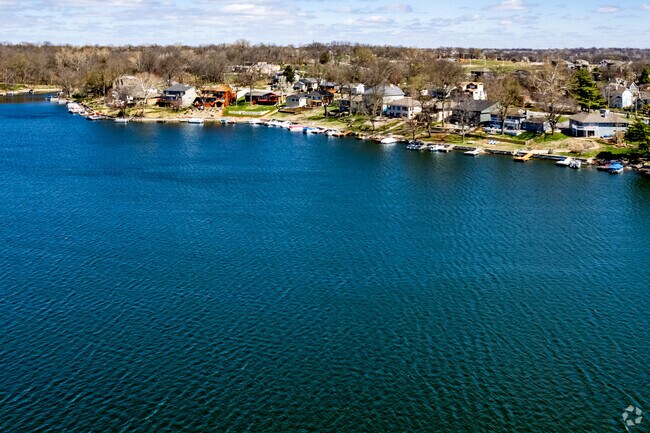 Homes in Lake Waukomis often have beautiful views of the deep blue Lake Waukomis.