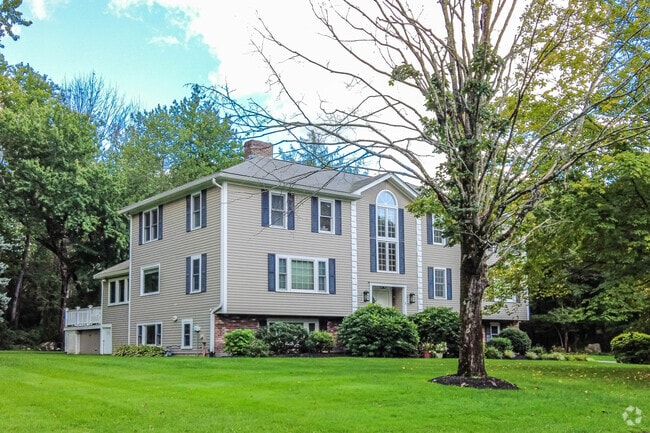 Large colonial home with green space in Bedford.