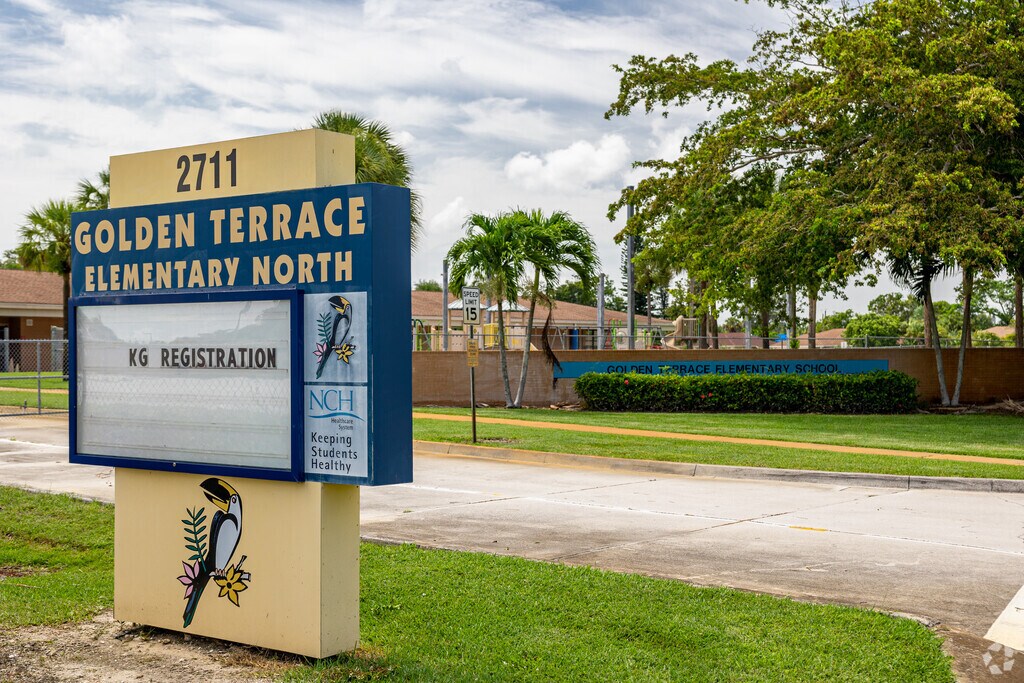 Golden Terrace Elementary School in Naples welcomes students with signs at the main entrance.