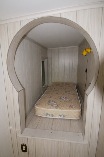 Studio apartment single cubbyhole bed