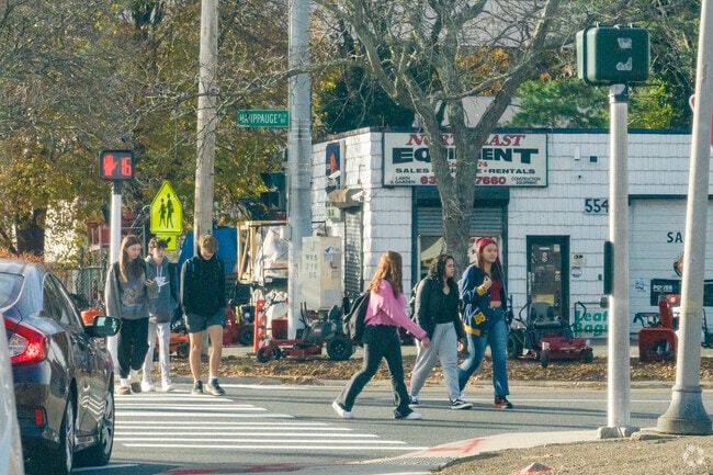 Students stroll Hauppauge Road toward nearby eateries after school.