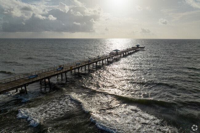 Go fishing out on the pier in Lauderdale-by-the-Sea.