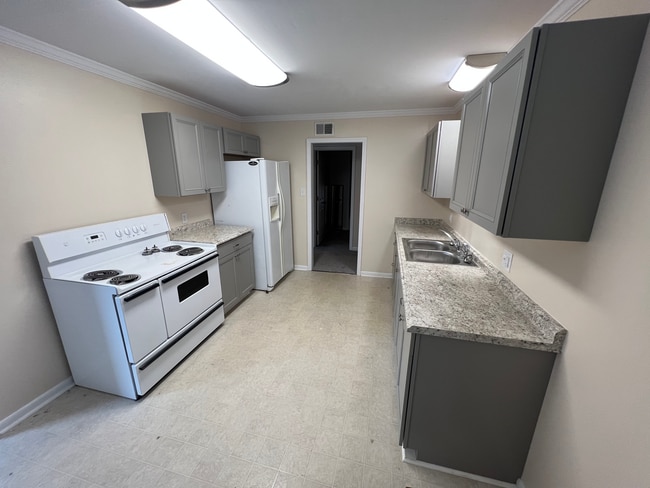 Kitchen view standing in dining area.