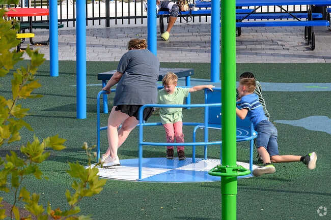 Children play at Play Michigan in Adado Riverfront Park, near The Stadium District.