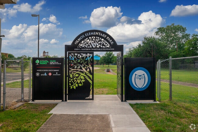 A beautiful cast iron gate leads to the playground at Olmos Elementary School.