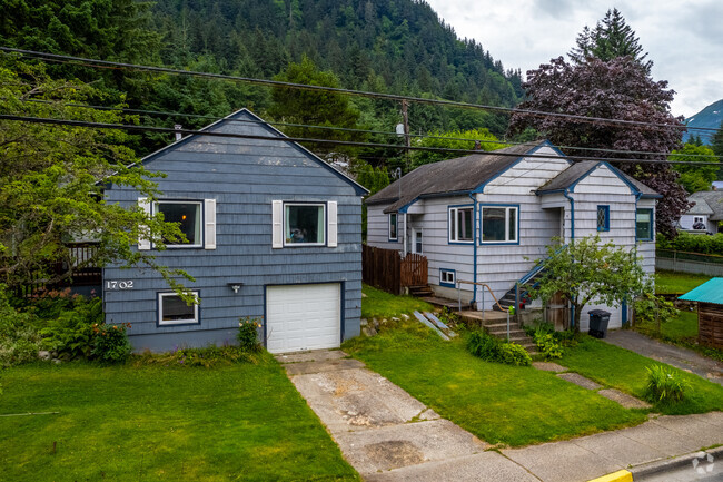 Some homes in North Douglas have a cabin aesthetic with wood paneling and earth-colored paint.
