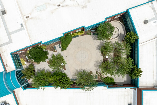 Trees shade the courtyard at Highland Park Elementary School.