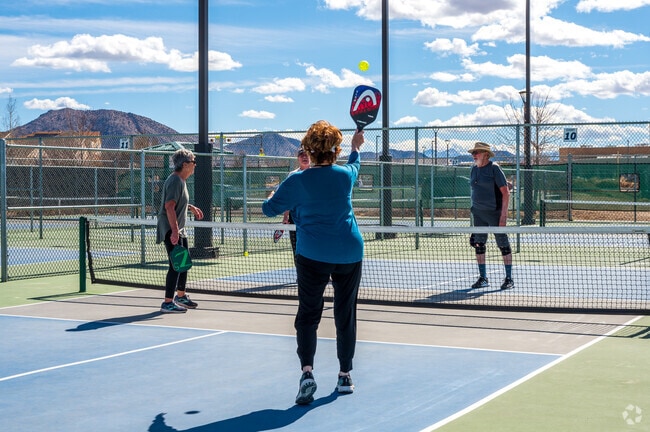Fairgrounds residents enjoy a game of pickle ball at Manazano Mesa Pickle Ball courts.
