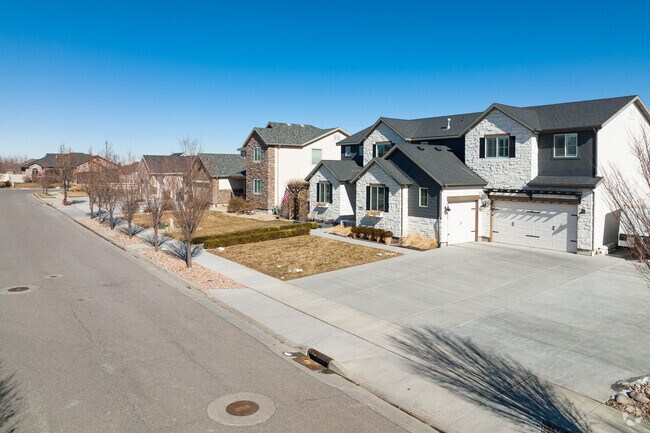 Enjoy spacious driveways and small lawns for easy maintenance in Jordan Hills.