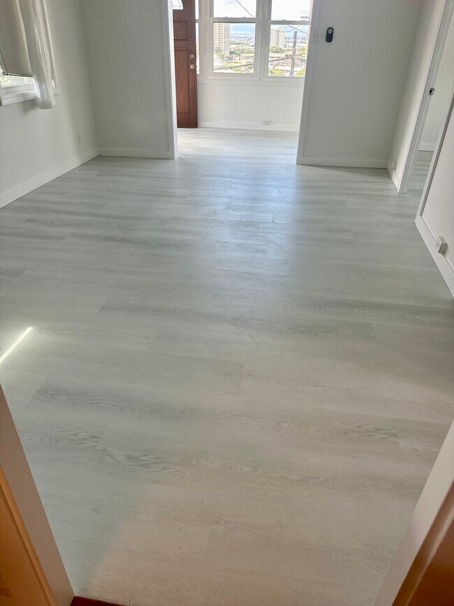 New 8mm luxury vinyl plank (LVP) flooring installed.