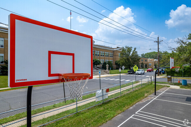 Play basketball at the courts by Audubon High School.