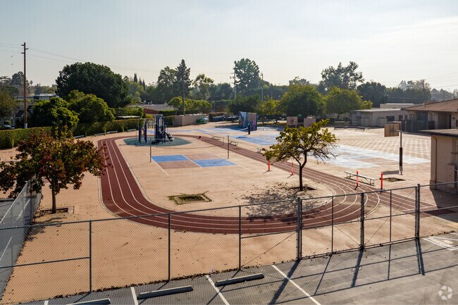 A large running track and other outdoor courts are provided at Overland Avenue Elementary.