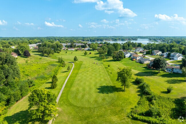 Four Seasons Country Club in Winfield, Indiana, showcases its lush green fairways, scenic water features, and surrounding residential charm.