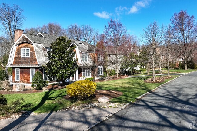 Many streets in Millburn, NJ, feature a variety of home types, often changing from lot to lot.