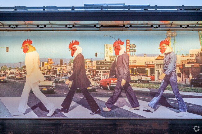 An amusing chicken mural in Costa Mesa resembles an album cover of a famous band.