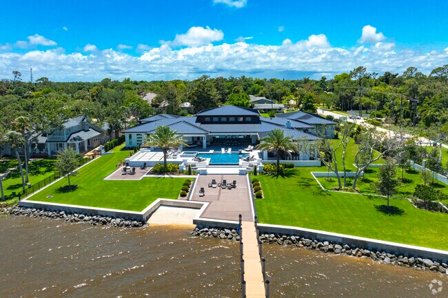 This sprawling Woodmere estate has a spacious yard and ample outdoor living space.