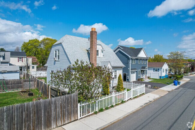 Cape Cod style home with fenced front yard in Piety Corner.