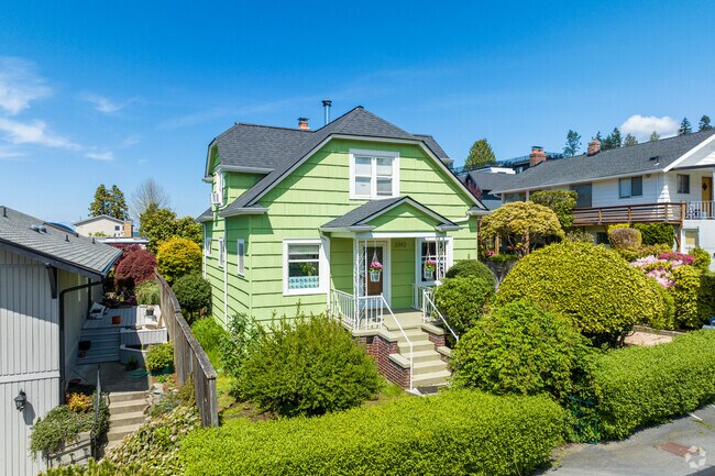 This gorgeous lime green cottage-style home stands out in North Beach.