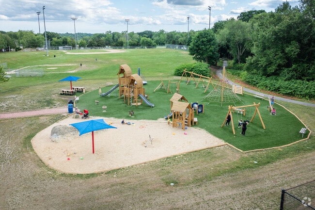 Kids and families have fun at the playground in Swansea Park, North Swansea, MA.
