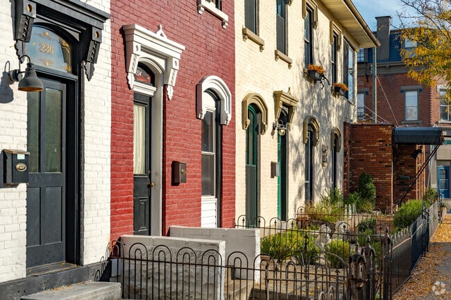Historic Italianate homes on Elm Street are painted in different colors.
