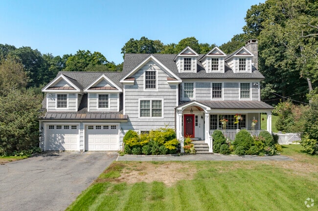 A larger home in West Norwalk with a two-car garage shines bright in the morning sun.